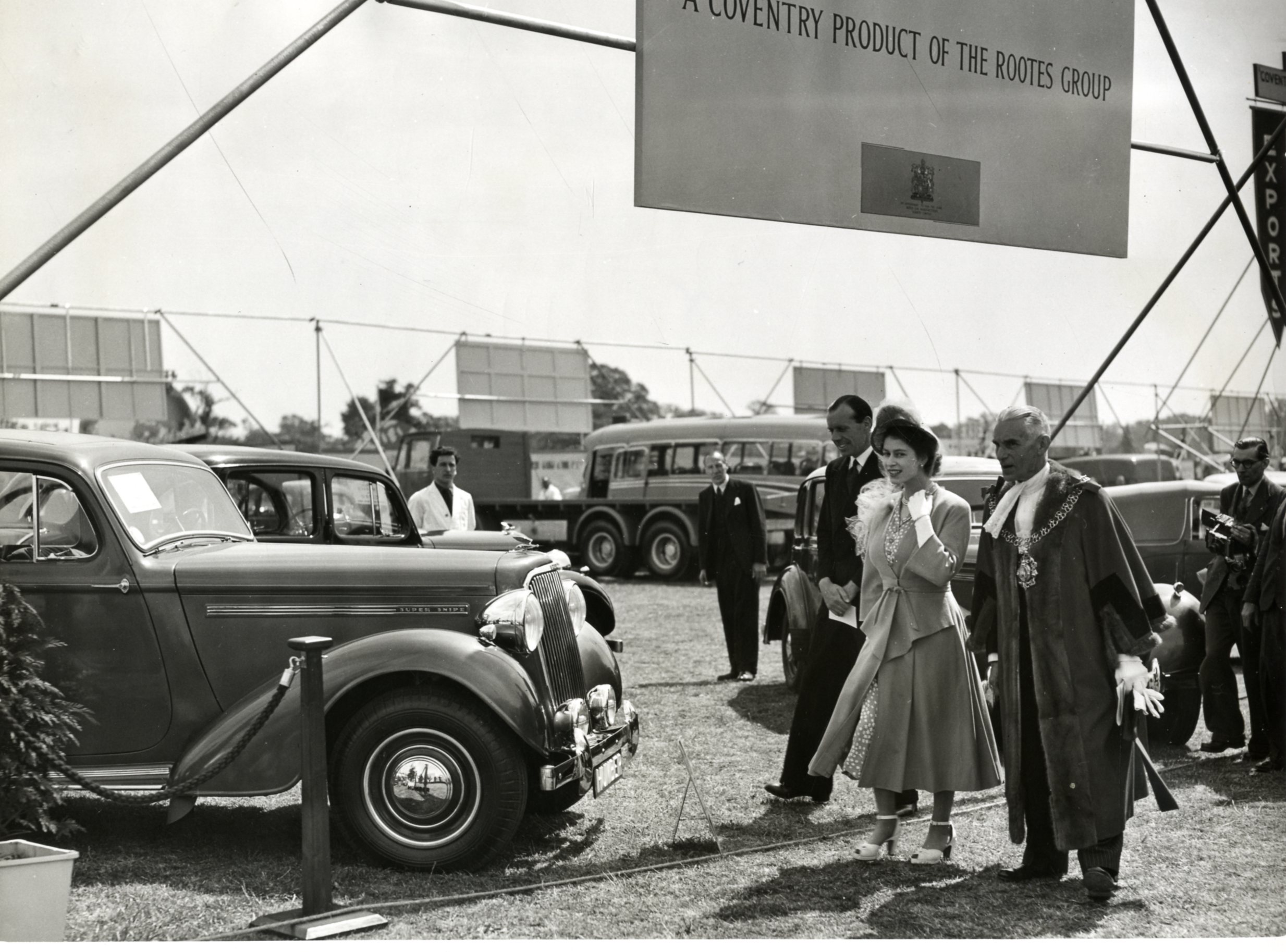Princess Elizabeth looking at a Humber Super Snipe on display as part of the Rootes Group exhibit in Coventry's War Memorial Park in 1948