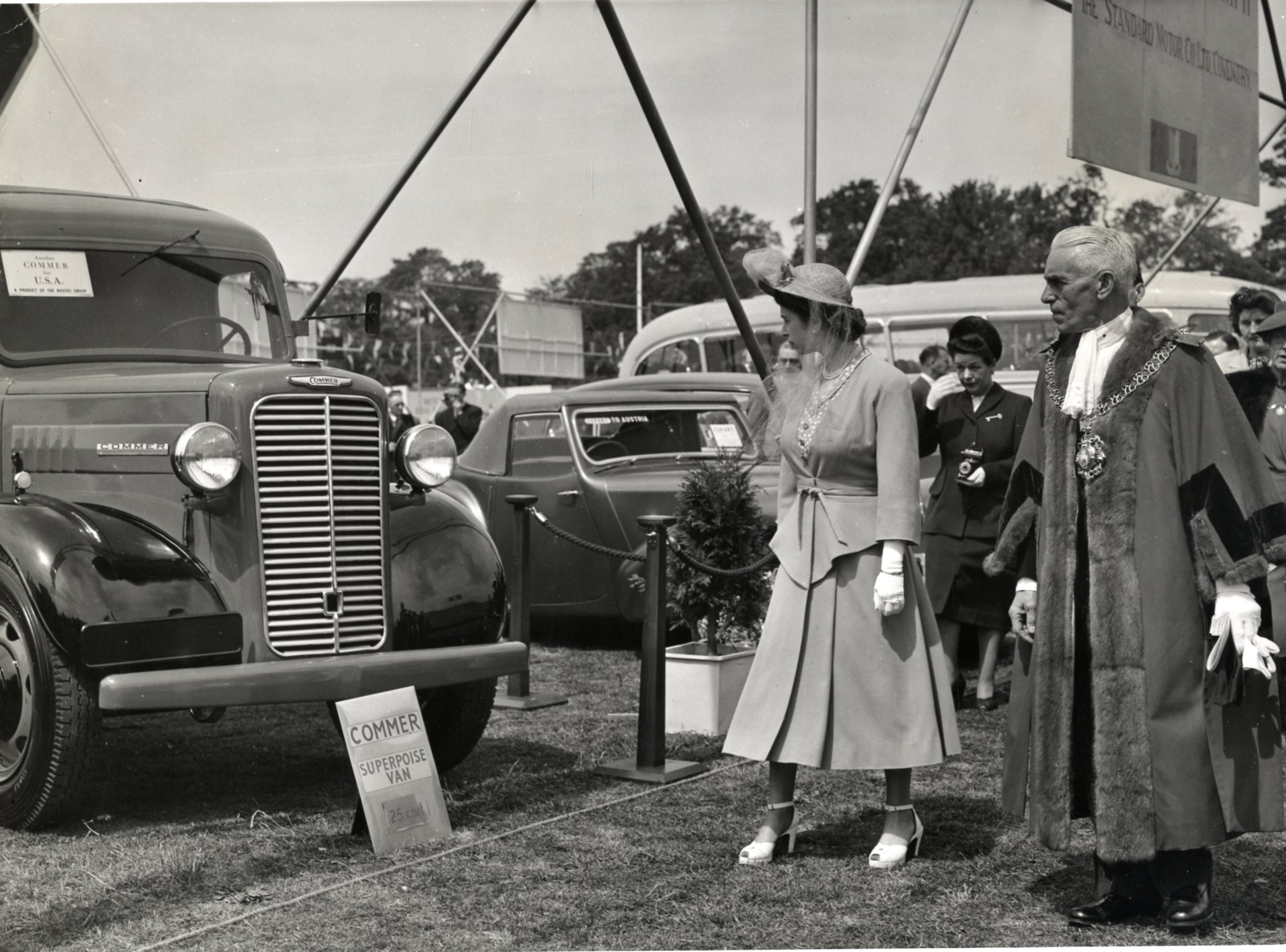 A black and white photograph of Princess Elizabeth looking at a Commer Superpoise van, part of the Rootes Group display in Coventry's War Memorial Park in 1948